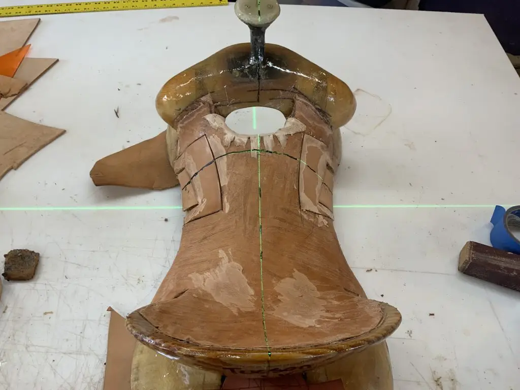 Properly aligned custom western saddle showing balanced saddle tree construction